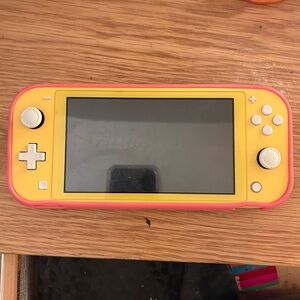 Yellow Nintendo Switch Lite (Comes with pink protective case)